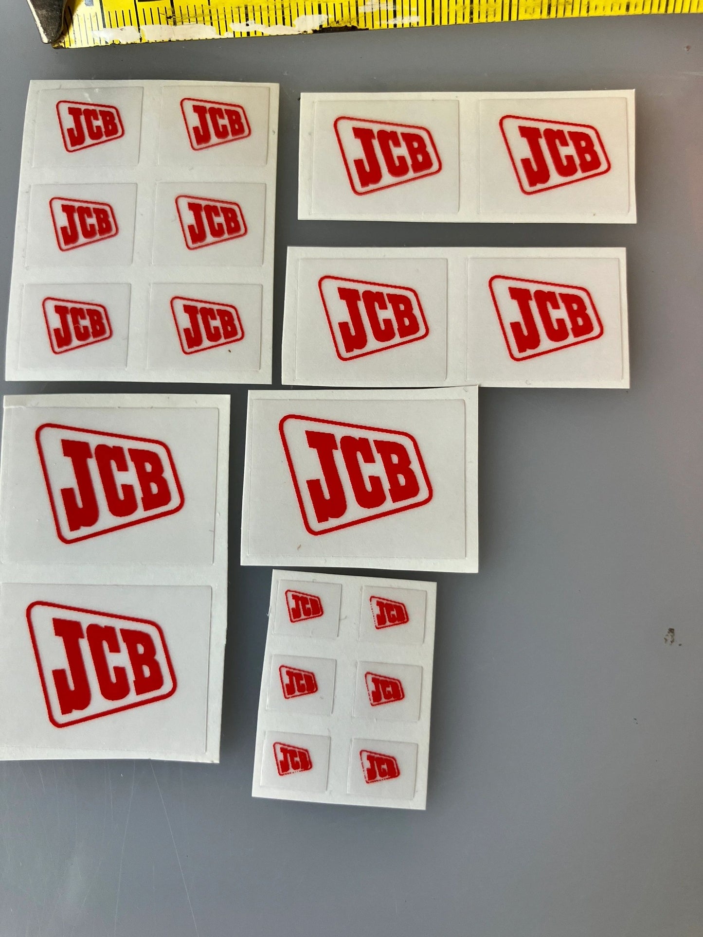 JCB red logos x 19 decal pack Professional Pre Cut High quality vinyl decal packs stickers 1:32 scale Loadall Digger Backhoe Image