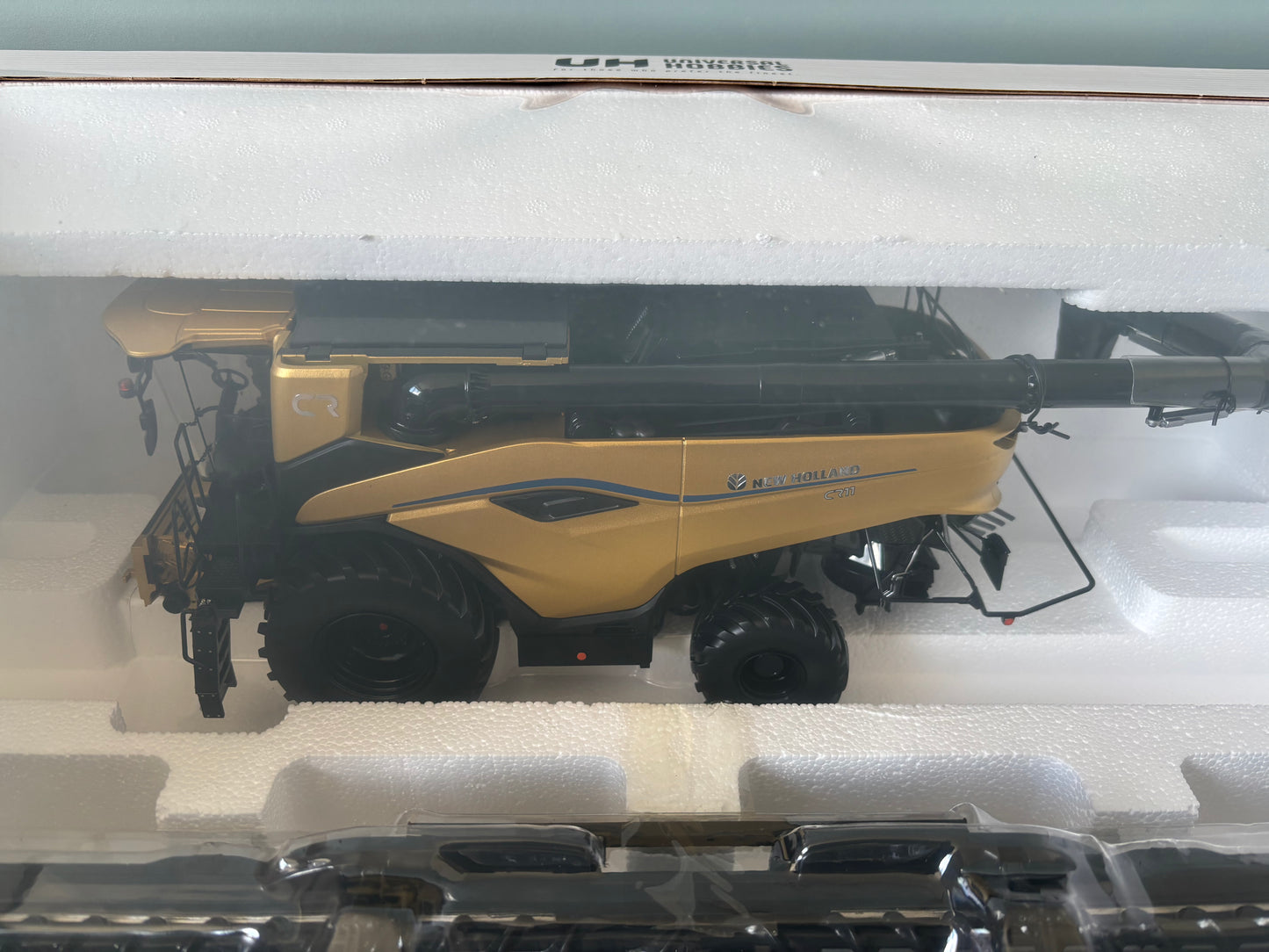 1:32 scale New Holland CR11 Gold Limited Edition combine harvester UH6829 by Universal Hobbies, gold display model.