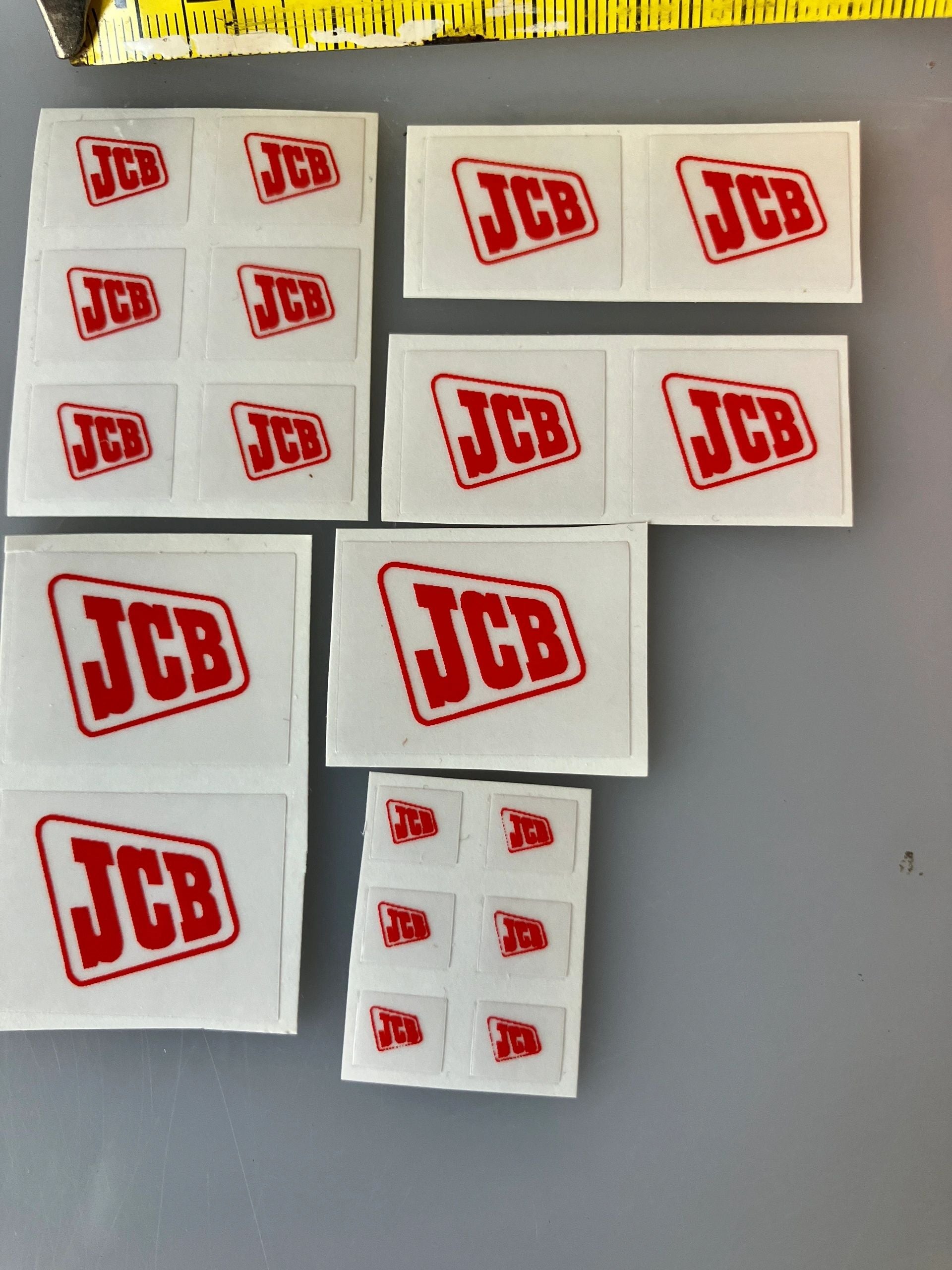 JCB red logos x 19 decal pack Professional Pre Cut High quality vinyl decal packs stickers 1:32 scale Loadall Digger Backhoe Image