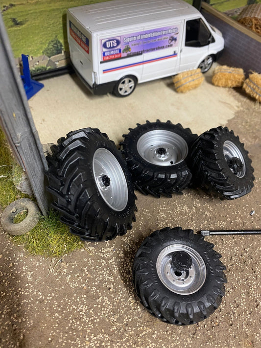 Set of 4 Silver New Holland tractor wheels tyres 1:32 scale 45mm x 17mm. 57mm x 20mm Image